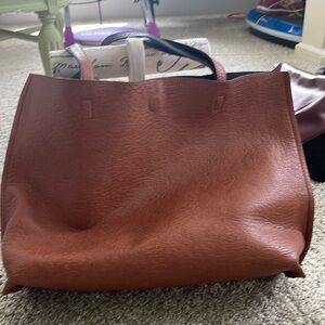 Tan& black reversible with magnetic closure